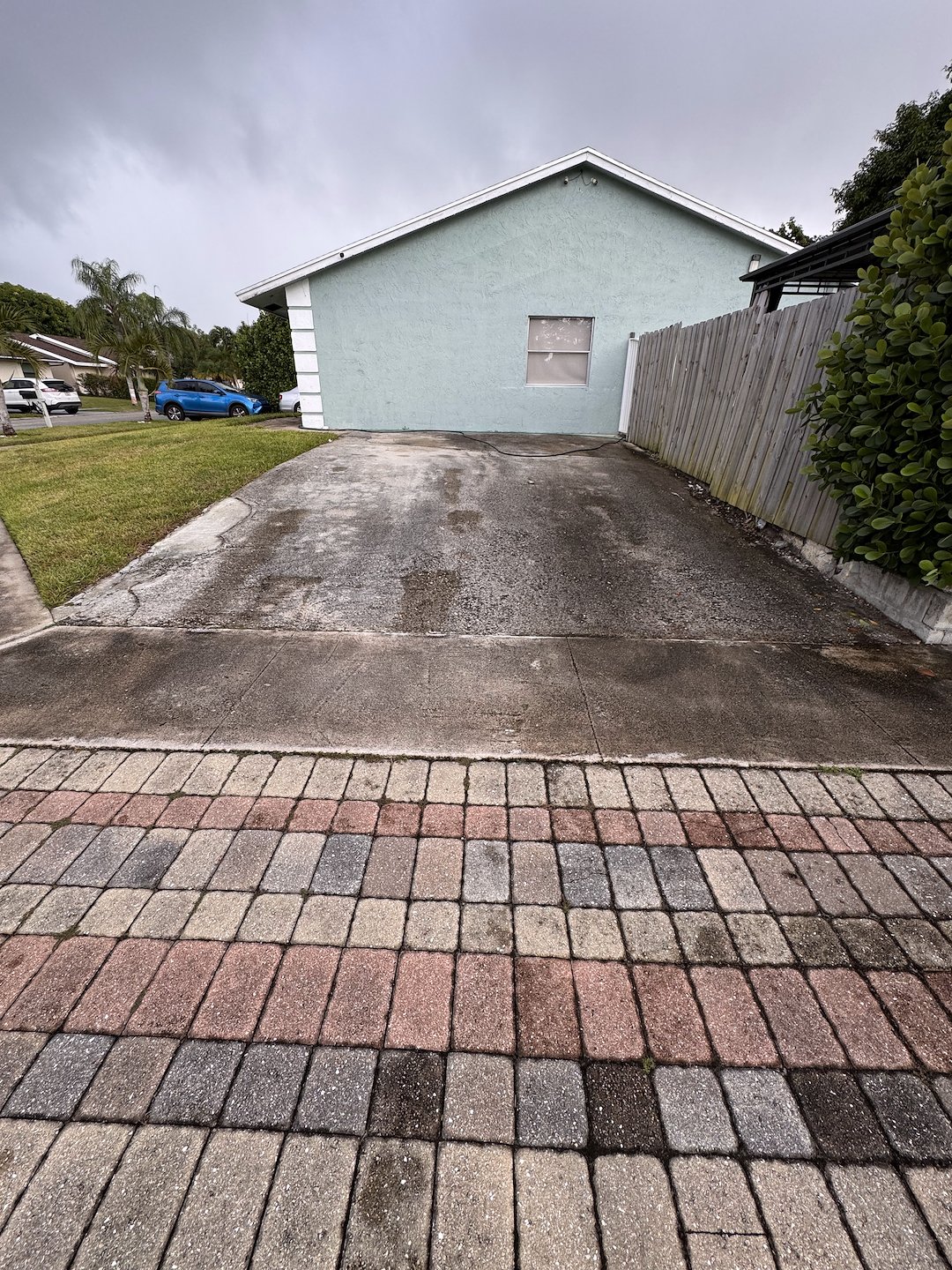 Professional pressure washing of back patio, Concrete driveway and sidewalk in Greenacres, FL 33463